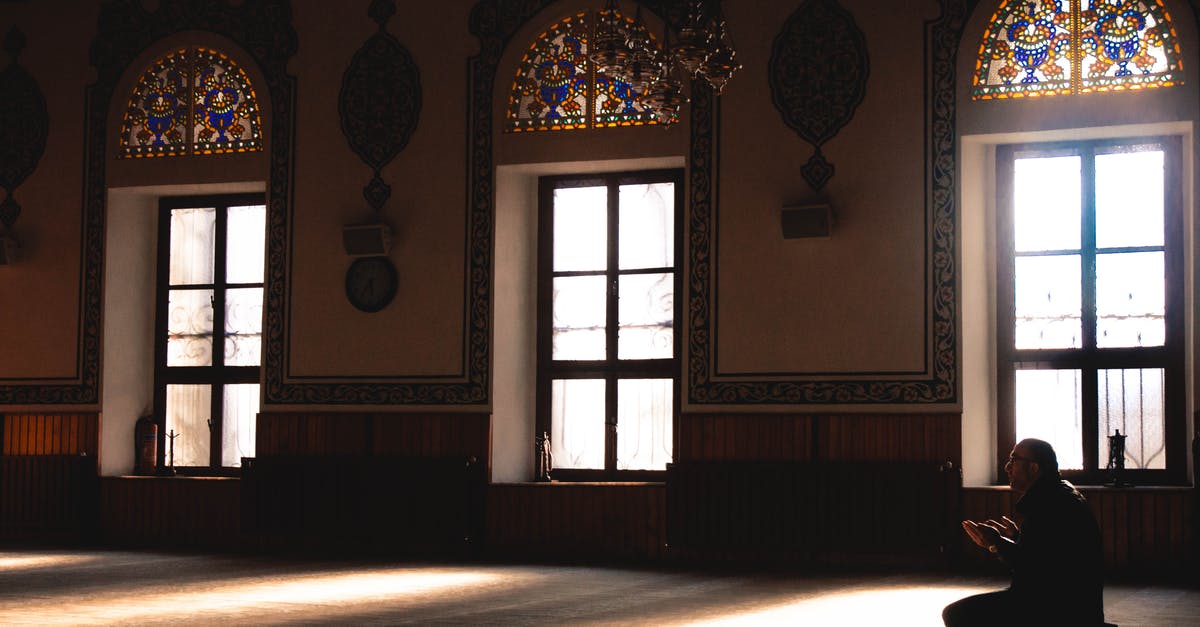 Stay longer than grace period on a J-1 Visa - Photo Of Person Praying Indoors