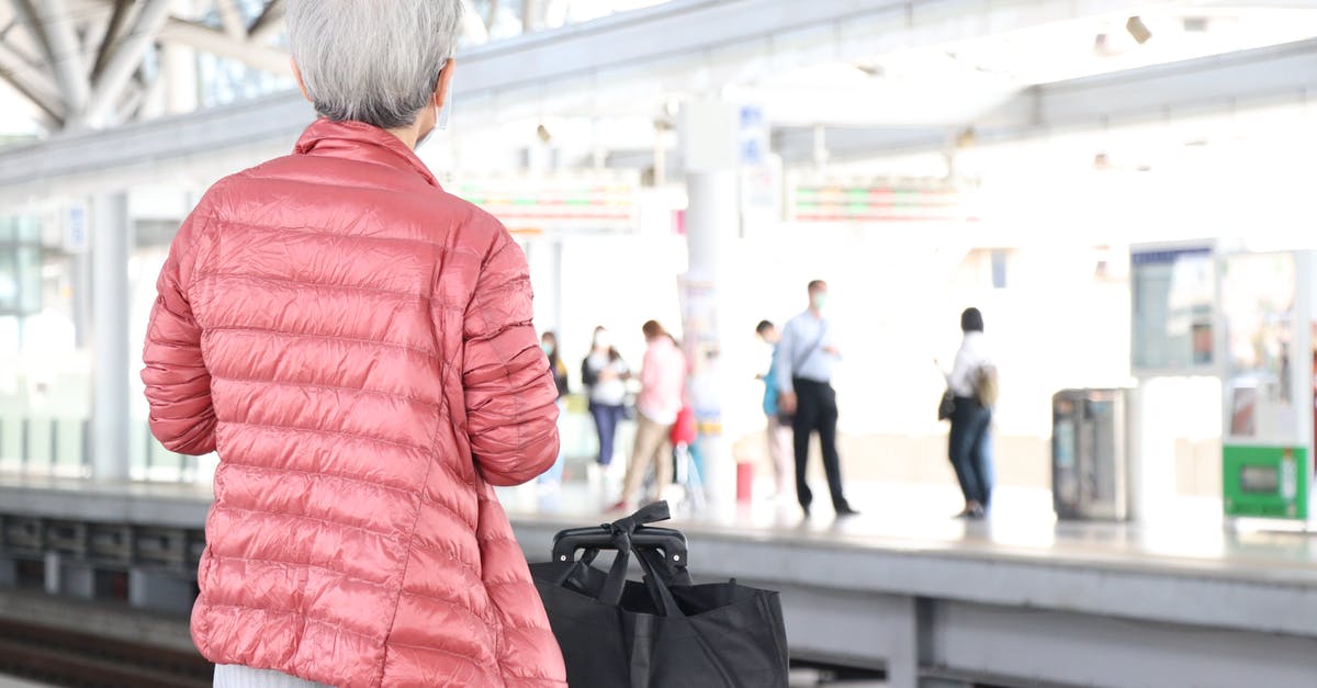 Storing luggage in Paris? - Woman Waiting on Train Station