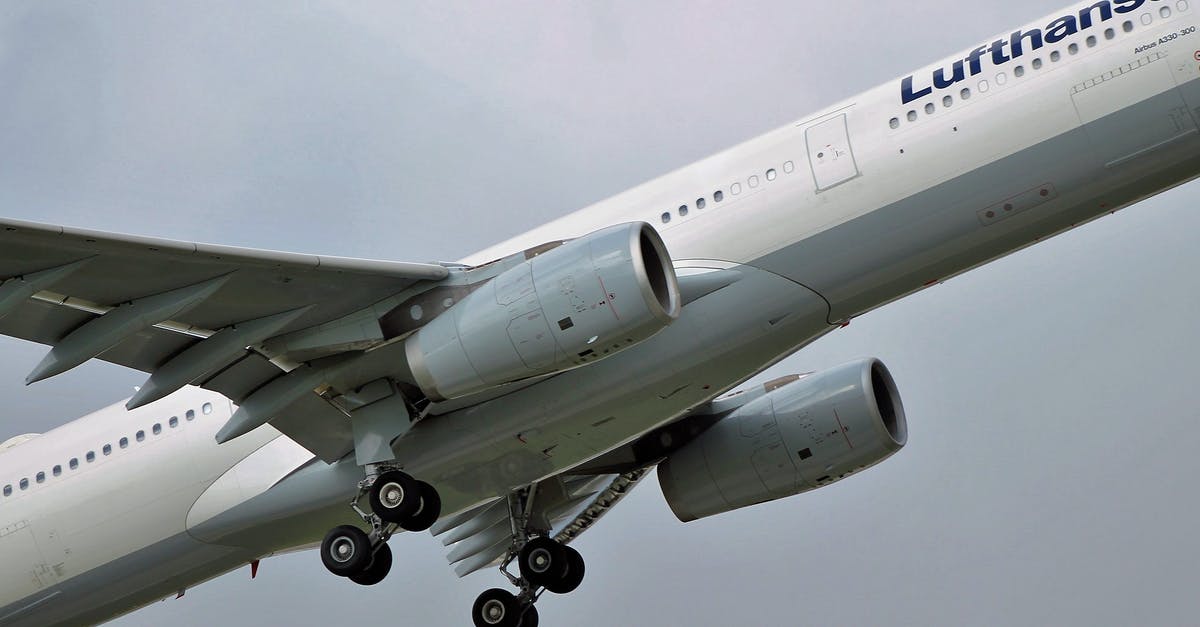 Stowage policy for take off and landing for airlines in Europe - Modern aircraft flying in cloudy gray sky