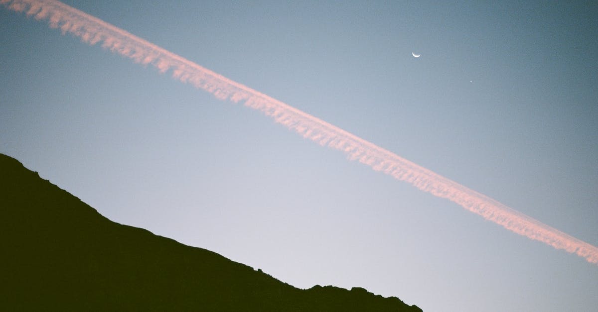 Straight razor on a plane to Moscow from abroad - Bright blue sky with airplane cloud near slope