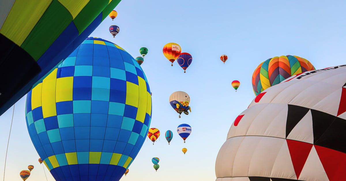 Strange flight pattern - right now BA0213 - Low Angle Shot Of Airborne Multi-Colored  Hot Air Balloons