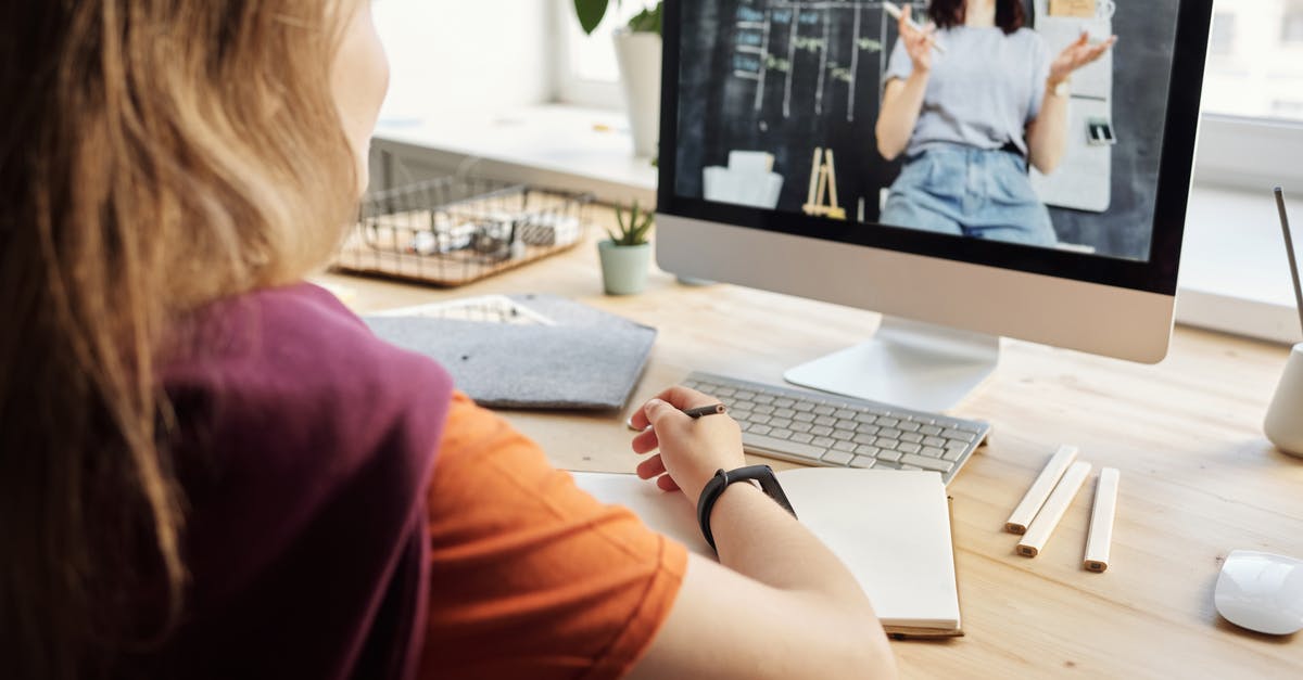 student staying in the uk - Photo of Girl Watching Through Imac