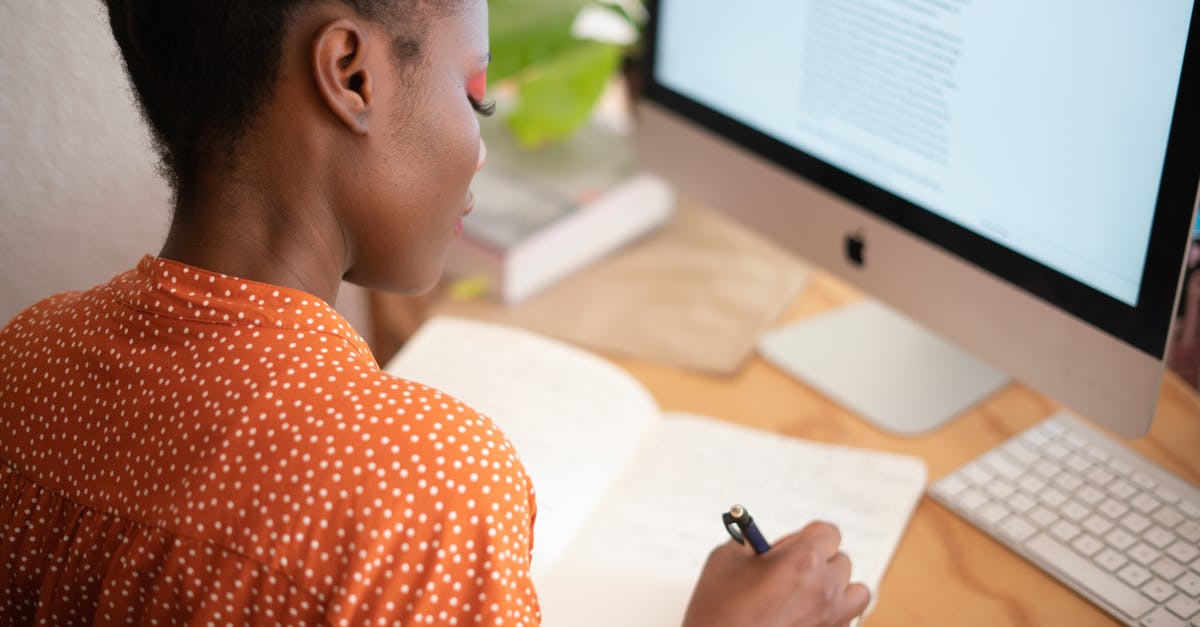 Subject Access Request - UK HOME OFFICE - Woman Writing on Her Notebook