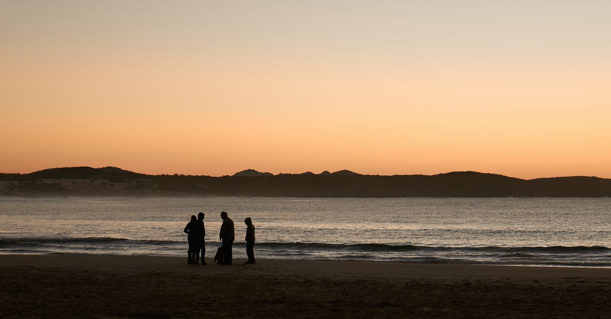 Sum miles in only one miles program - Silhouette of People at the Beach