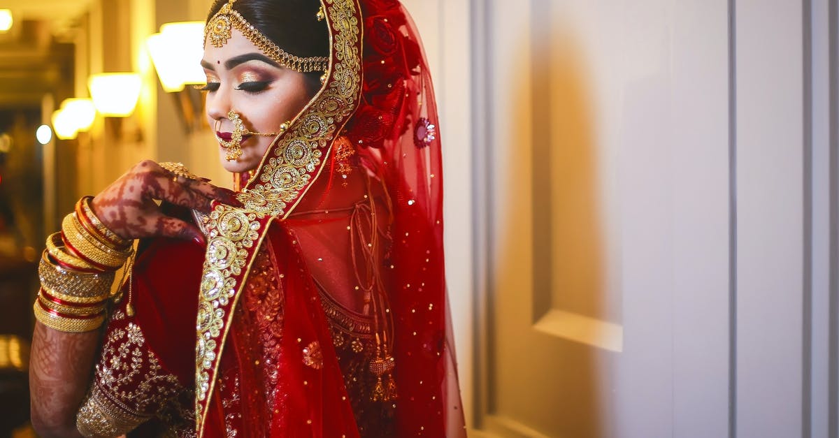 Suspended SIM in Bangladesh [closed] - Woman in Floral Dress Standing Beside Door