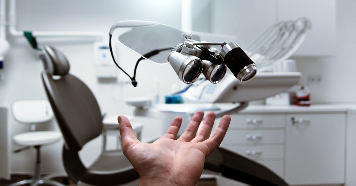 Sweets as gifts in lands untouched by modern dentistry - Person Showing Magnifying Eyeglasses