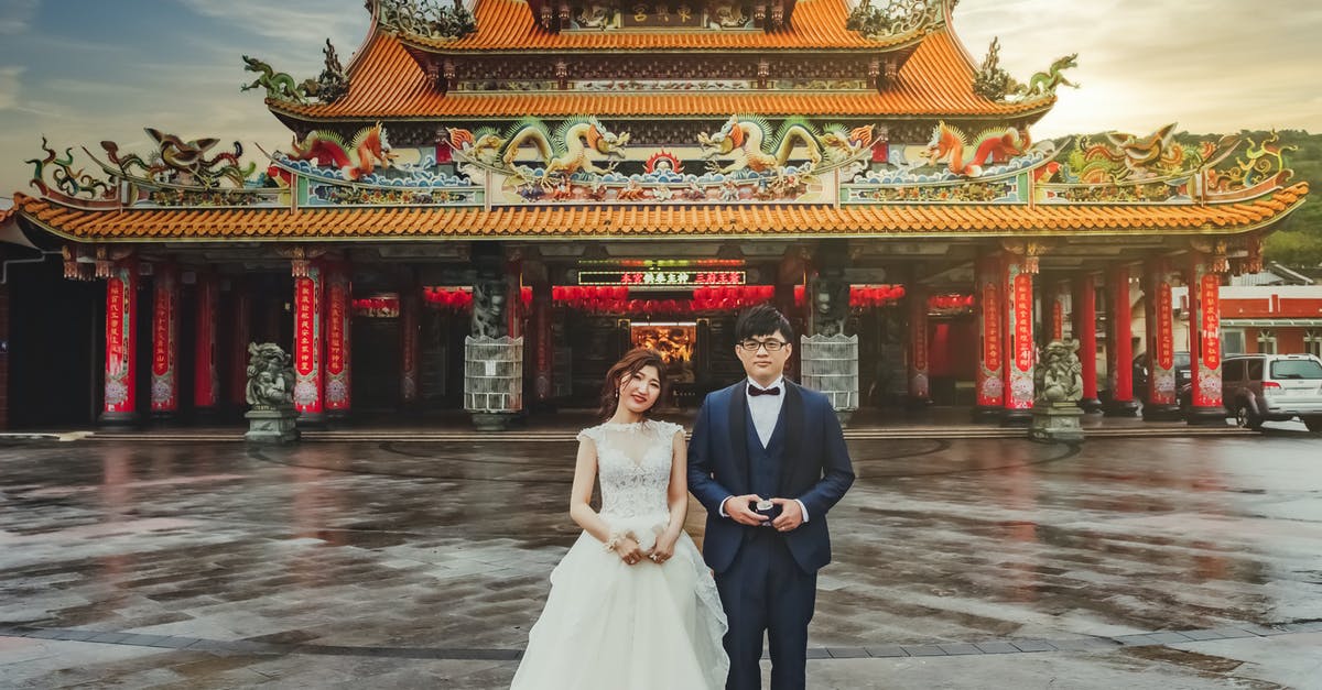 Taiwan maximum stay rules with reentry - Man and Woman in Wedding Dress Standing Near Red Temple