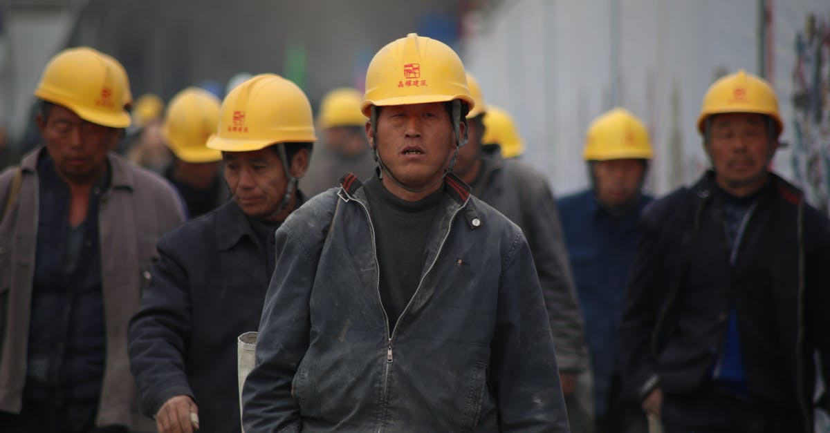 Taiwan visa for Indians working in China - Group of Persons Wearing Yellow Safety Helmet during Daytime