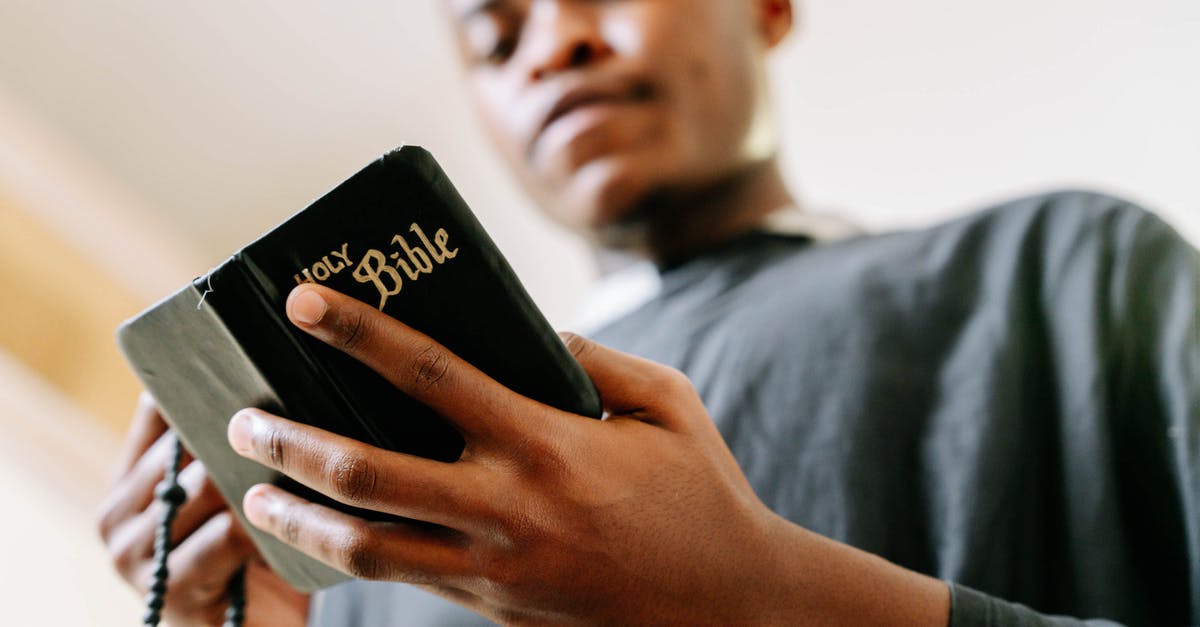 Taizé prayer in Bucharest: where? - Man in Gray Shirt Holding Black Samsung Android Smartphone