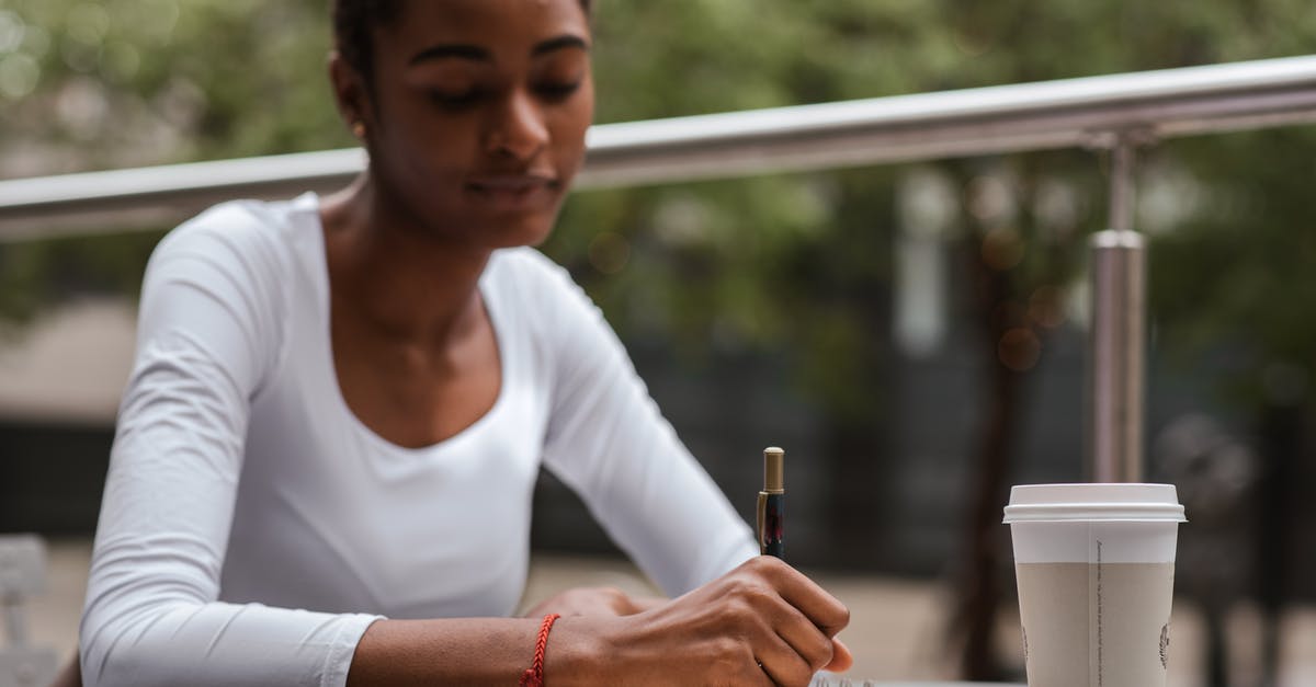 Taking fennel tea bags into Canada - Black woman with coffee and pen on terrace