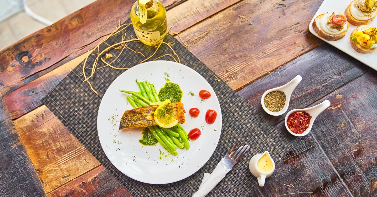 Taking olive oil from Turkey to Germany in check-in luggage? - Grilled fish steaks served with vegetables and sauces