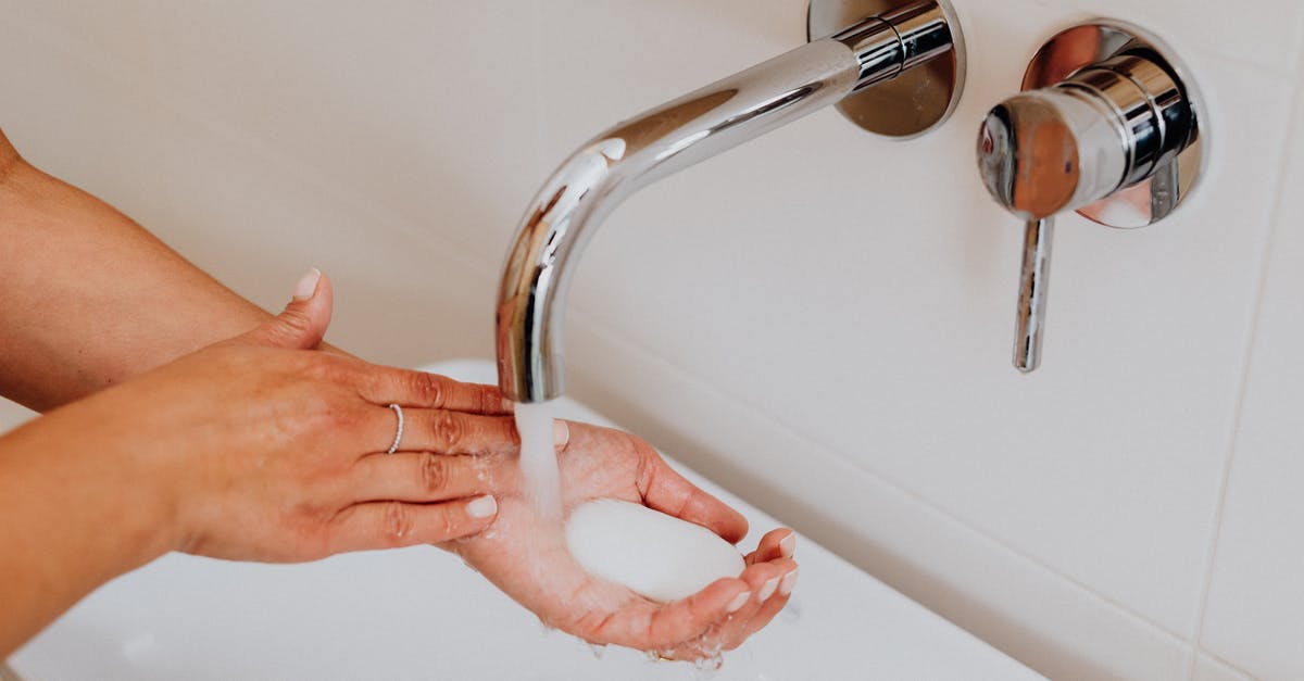 TAP Airline Refund - Person Holding Stainless Steel Faucet