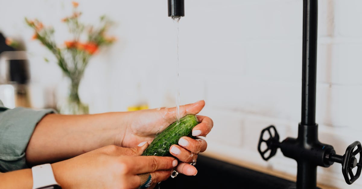 TAP Airline Refund - Person Holding Green Vegetable With Water Droplets