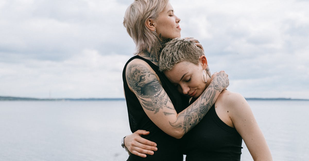 Tattoos while Traveling Overseas - Women Hugging on Beach