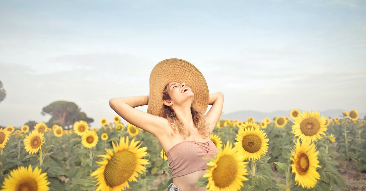 Tax Free when leaving EU through a different country - Woman Standing on Sunflower Field