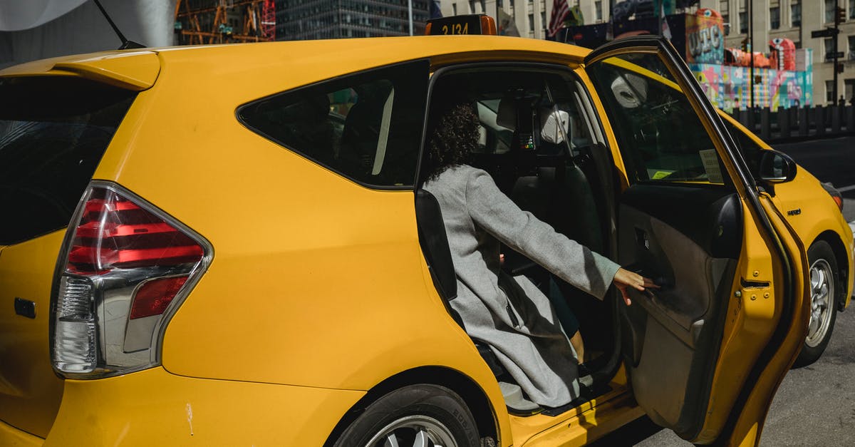 taxi from gare du nord, Paris to avenue lamotte-piquet? [closed] - Ethnic woman closing door of taxi