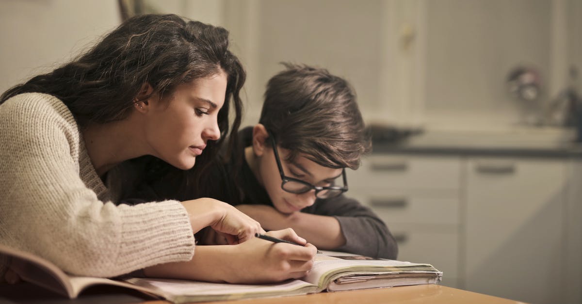 Teen child traveling with family member within US - Focused students doing homework at home