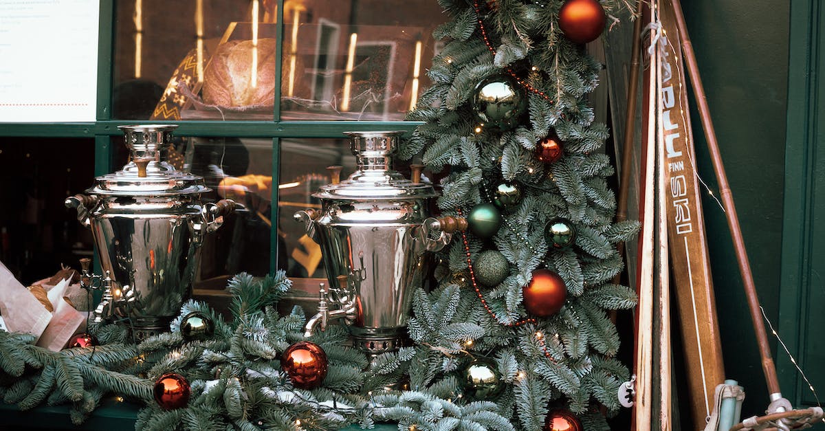 Temporary exhibitions in Helsinki before christmas - Green Christmas Tree With Red Baubles and Candles