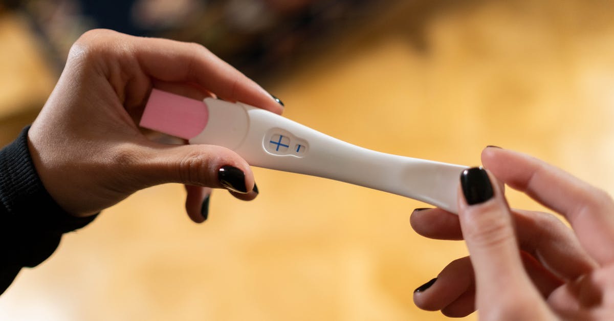 Testing Kit to Transit Heathrow to Belfast? - Hands Holding Pregnancy Test Kit