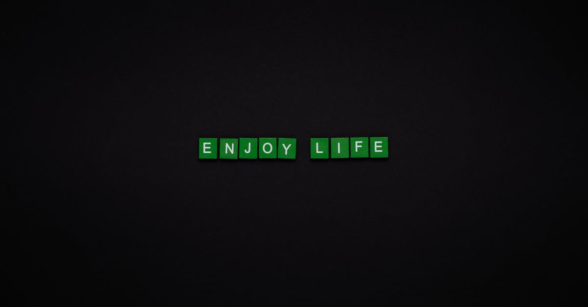 Text message delivery time from Europe to Asia - Enjoy Life Text On Green Tiles With Black Background