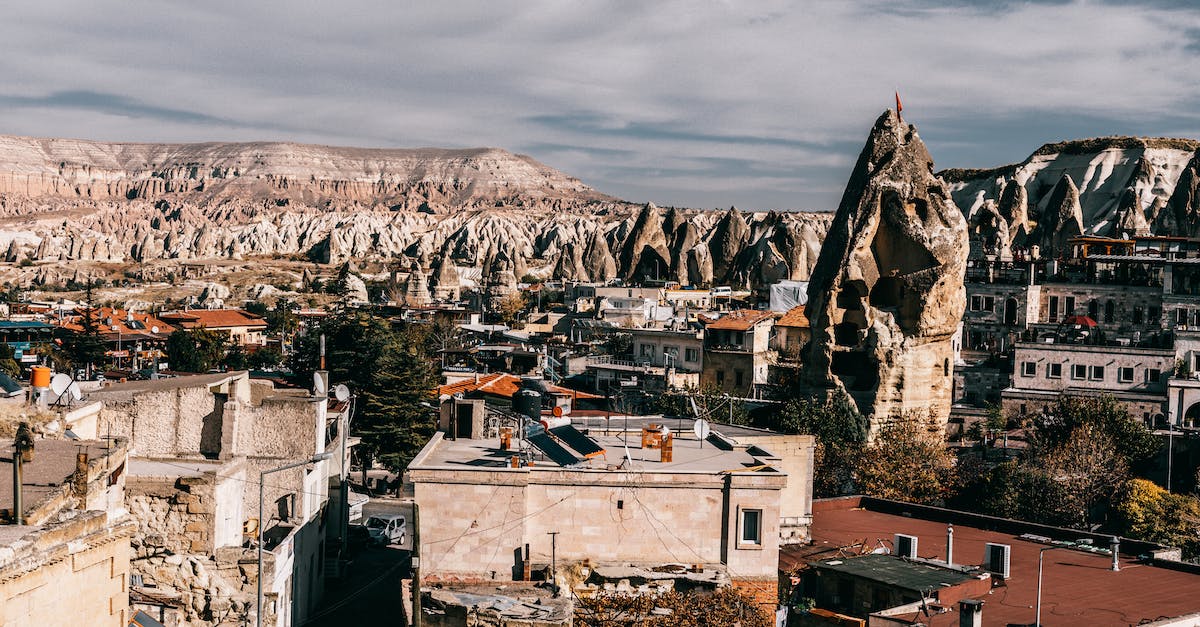 Things to do in the Peak District - Aged stone buildings surrounded by rocky formations located in old region of Turkey