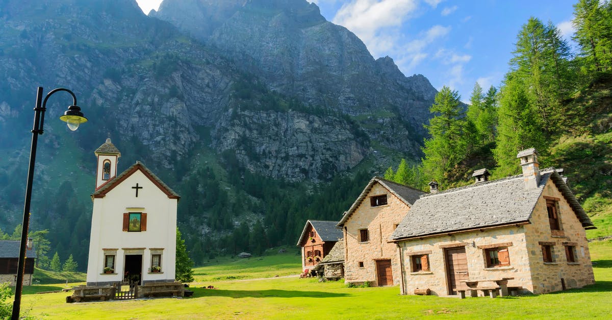 This Alpine town? - Three Houses Near Chapel Below Valley