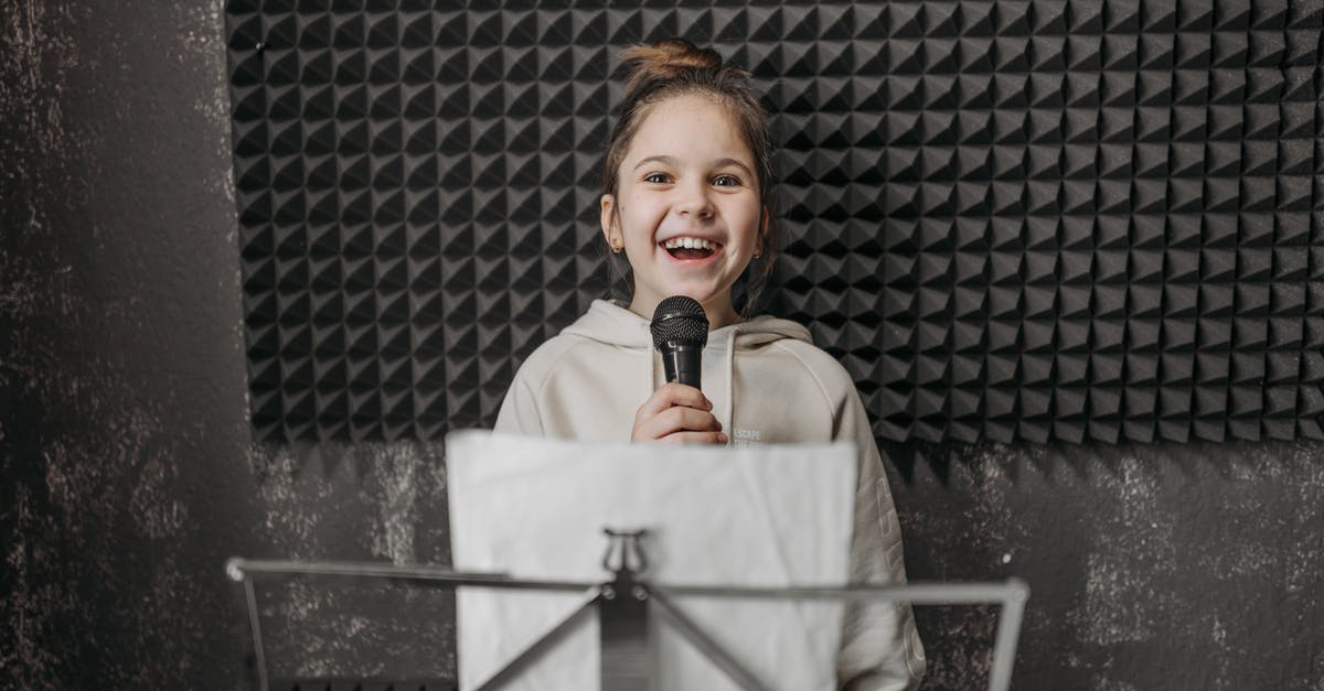 Throat singing lessons in Mongolia - kid Holding a Microphone inside a Music Studio