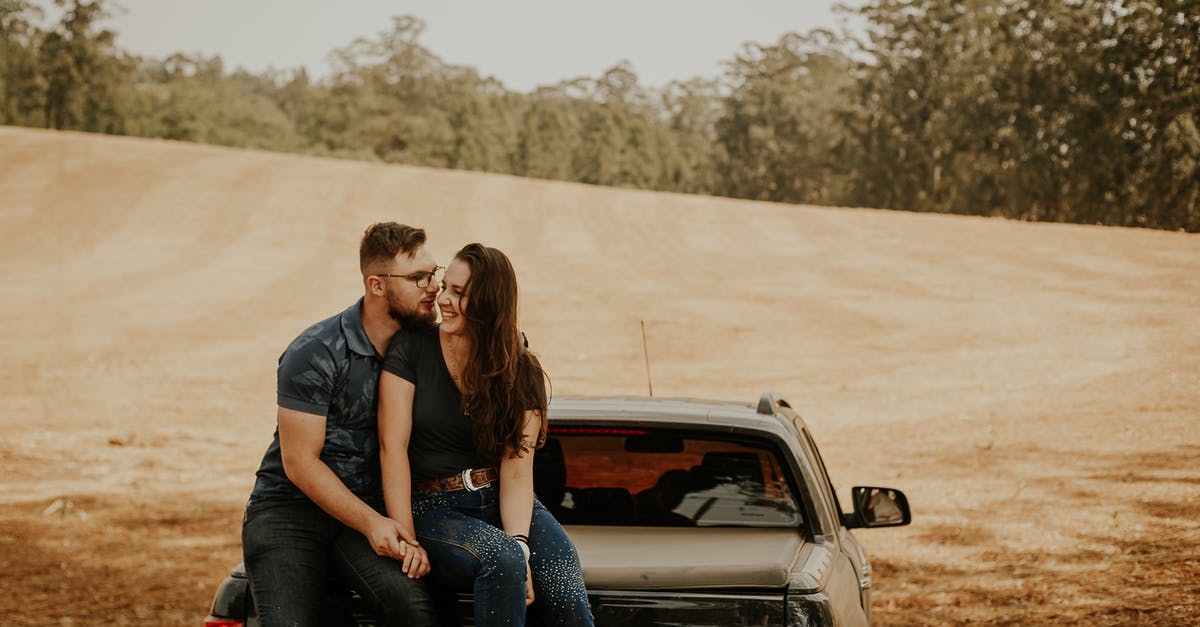 Throwaway ticketing: picking optimal return date - A Couple Sitting at The Back of a Pick Up Truck