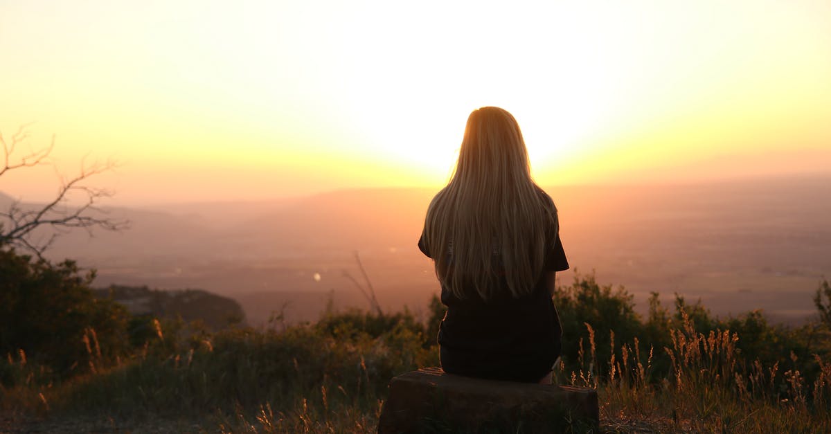 Tibet Xizang Travel: How to stay safe traveling alone [closed] - Woman Looking at Sunset