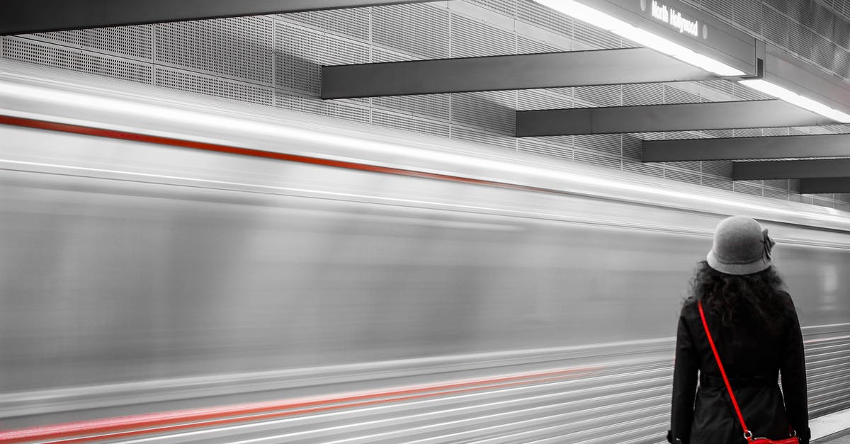 Time of first train from Rosas station to Valencia airport by Metro - Woman Wearing Black Coat