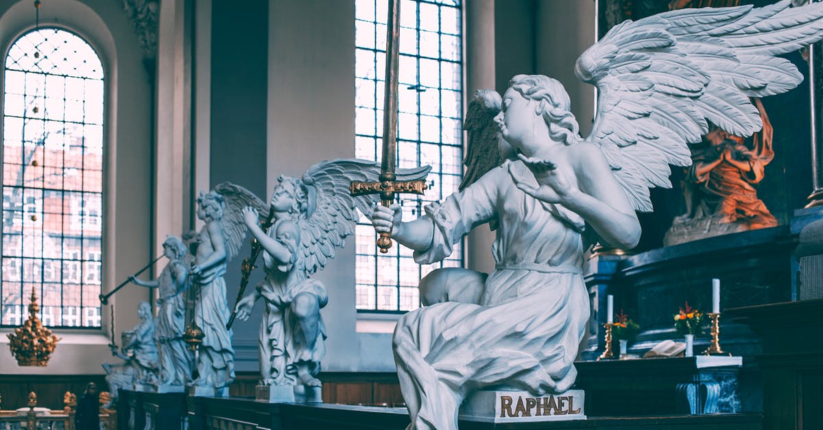 Tipping in Denmark - Baroque altarpiece decorated with white angels sculptures on marble railing located in Church of Our Saviour Copenhagen Denmark