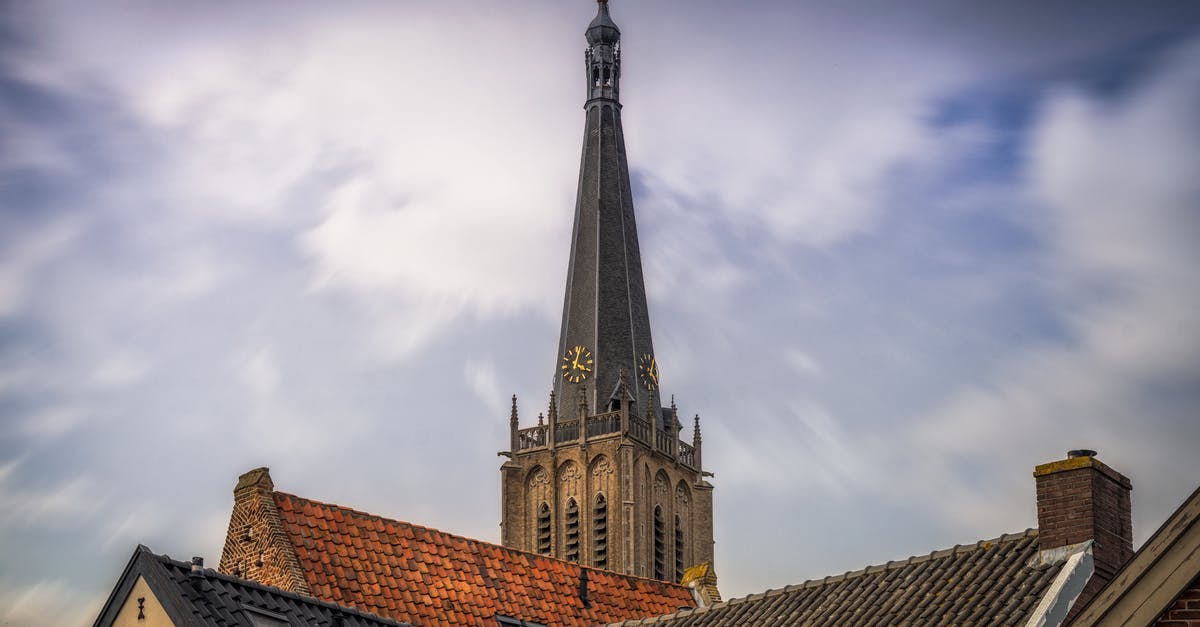 Tipping in the Netherlands - Brown and Gray Concrete Building Under White Clouds