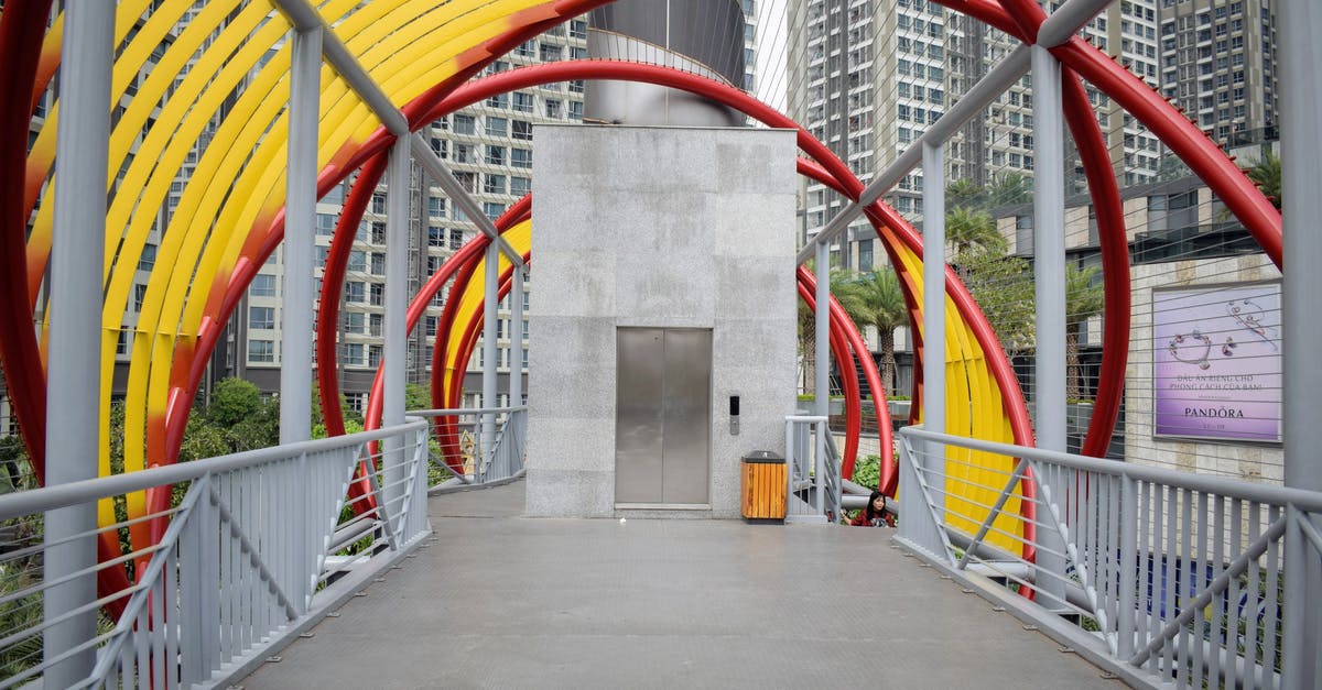 Tipping in Vietnam - Gray Concrete Building With Red Metal Railings