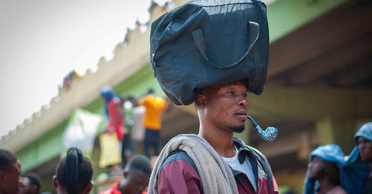 Tips to avoid forgetting a bag - Man in Gray Hat and Gray Jacket