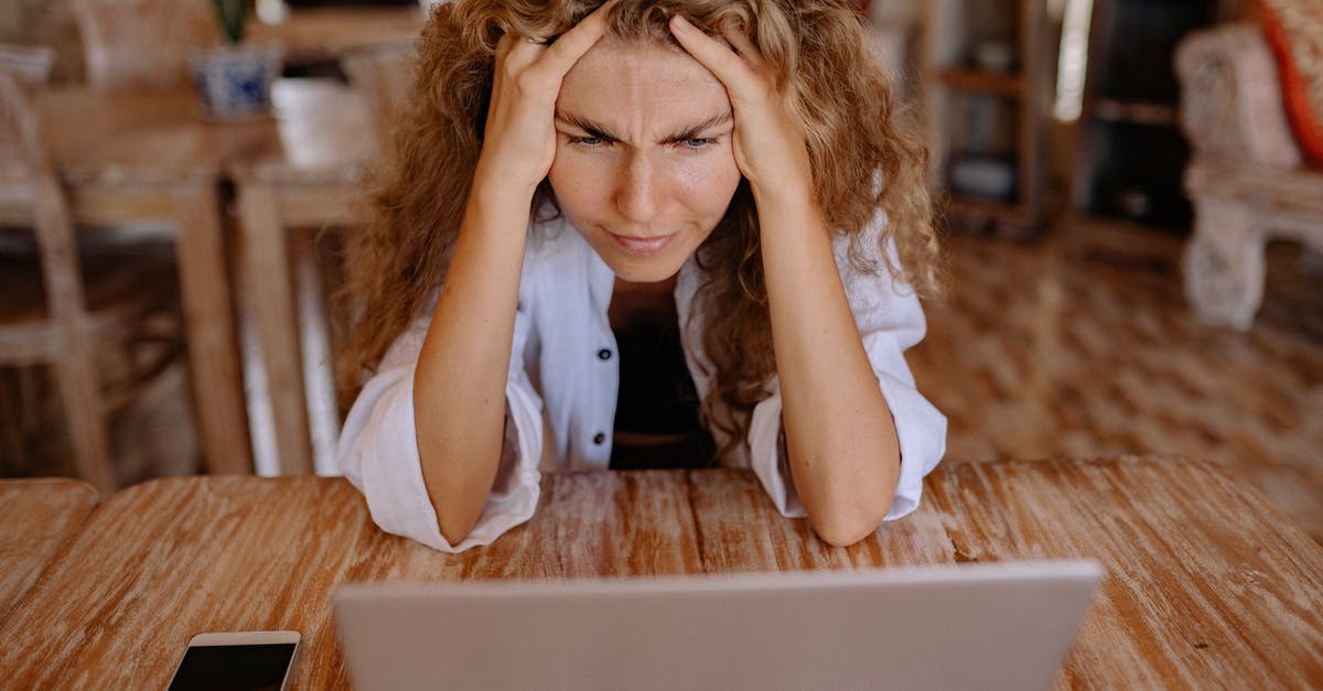 T-Mobile network in Thailand: Koh Phayam? - Photo of Woman Leaning on Wooden Table While Looking Upset