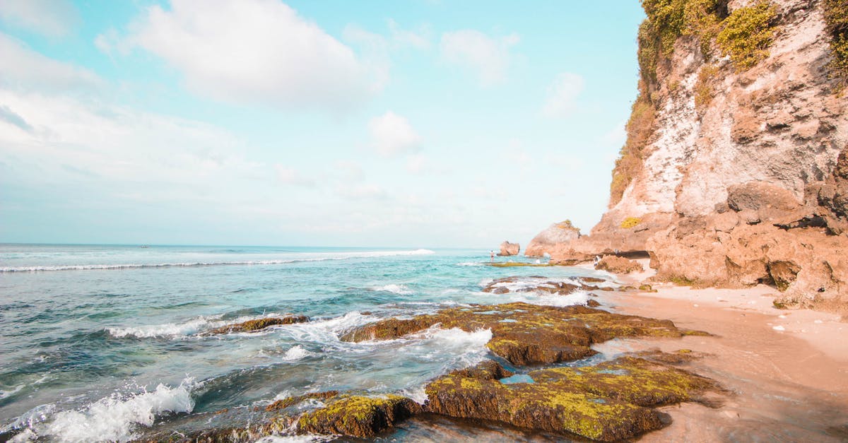 Toronto Airport (YYZ) to Sanur Bali Indonesia - Brown Rock Formation Near Sea