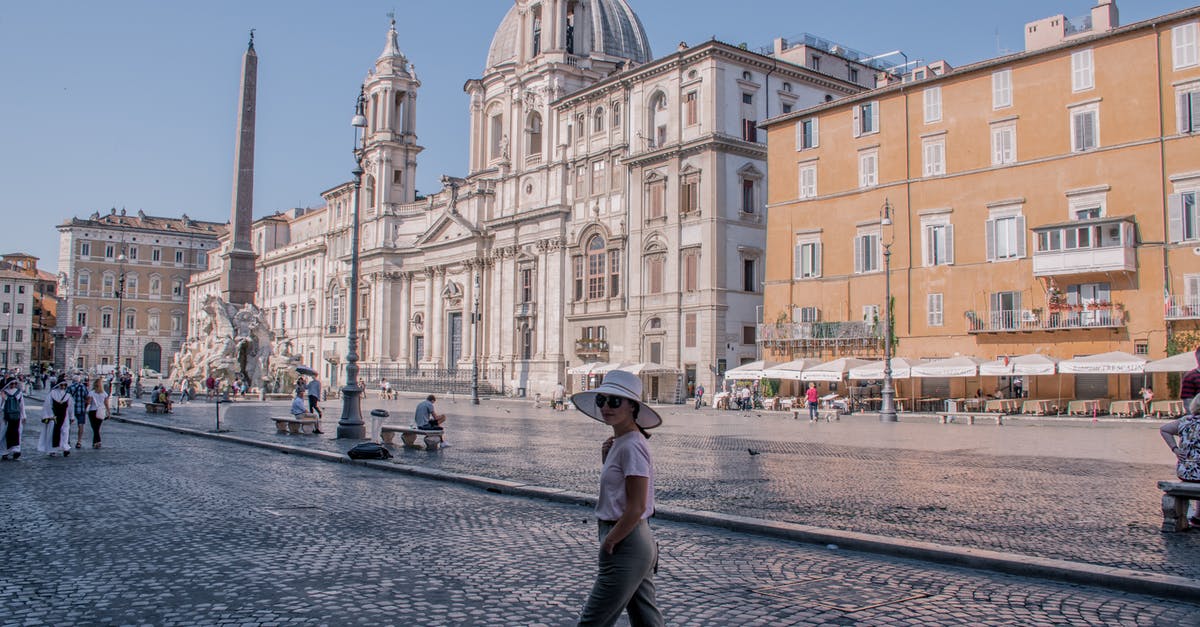 Toy vendors in Rome (on the piazza) - Woman Standing Near White Dome Building