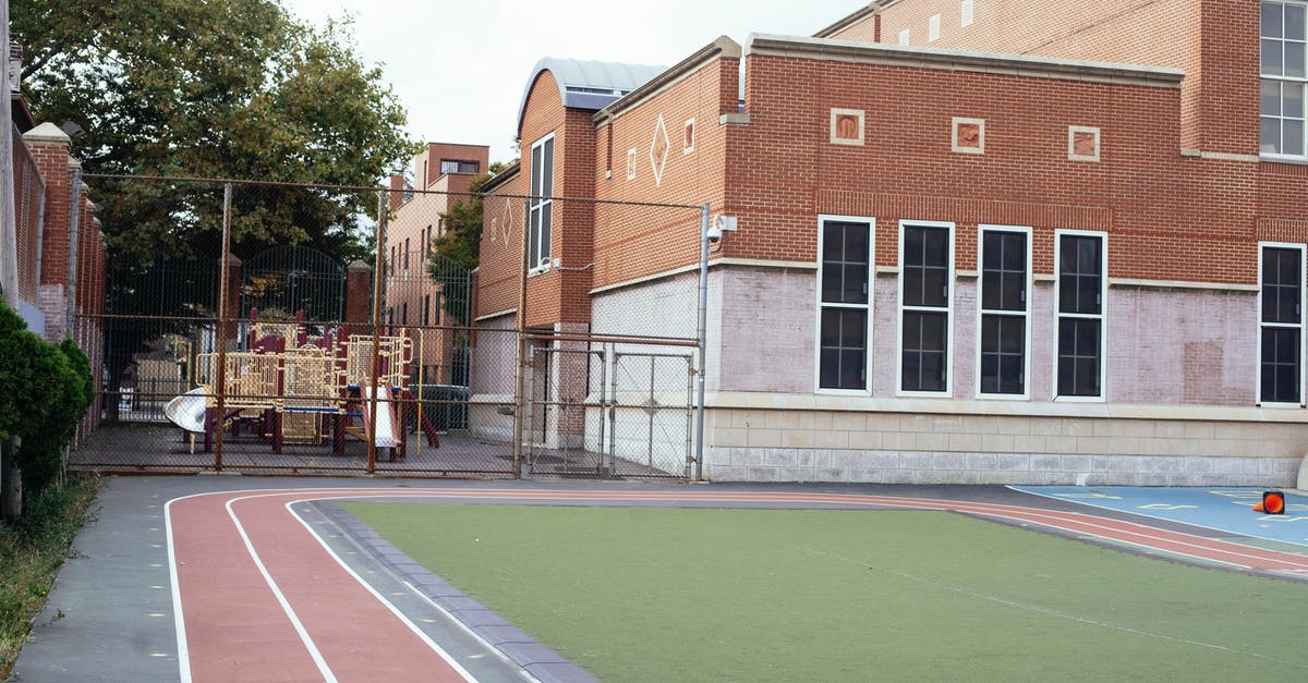 track airline miles in single location - Empty sports ground near school