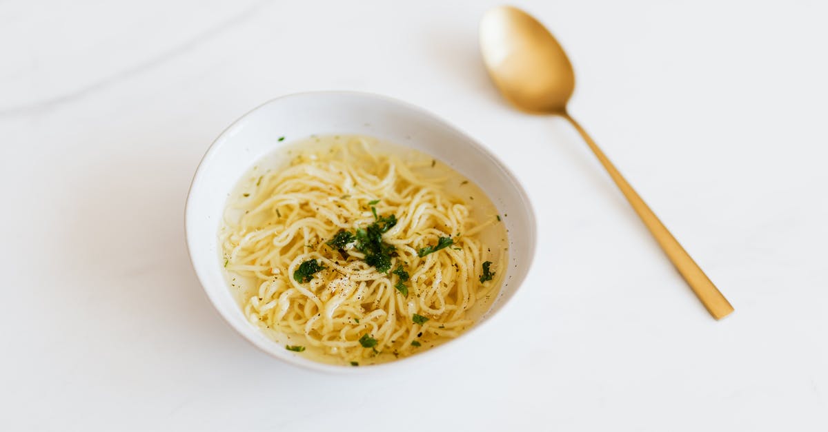 Traditional vegetarian dishes in Bavaria? - Bowl with tasty noodle soup near spoon