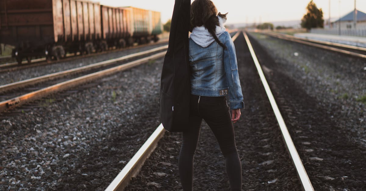 Train from Istanbul To Izmit and back - Woman Standing on Train Rail