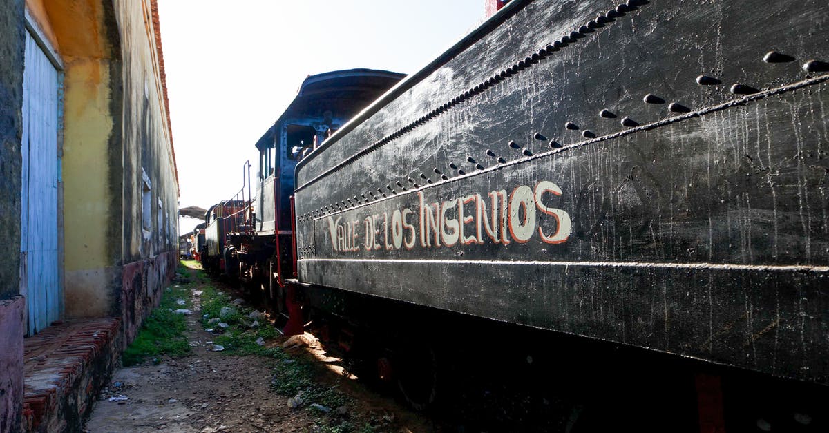 Train prices in Montenegro - Blue and Red Train on Rail Tracks