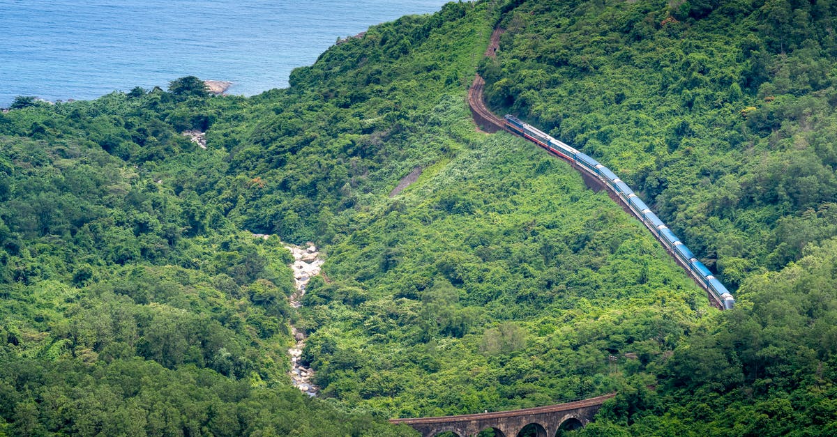 Train Route from CDG to Calais - Train driving on railway in green mountains