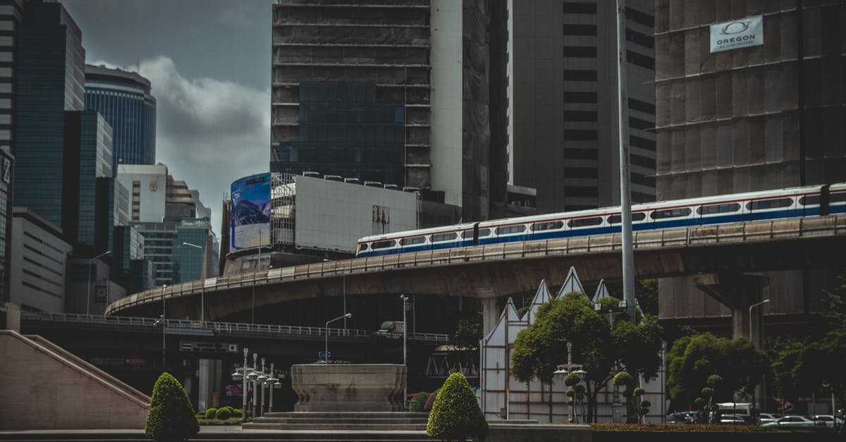 Trains in and out of Bangkok around Songkran - Photo of Park Near Buildings