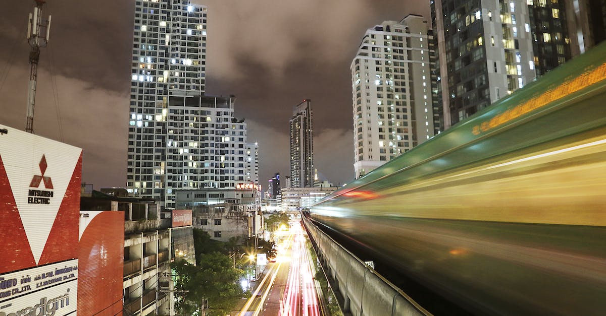 Trains in and out of Bangkok around Songkran - White and Yellow Vehicle Light on Road Time Laps Photography during Nighttime