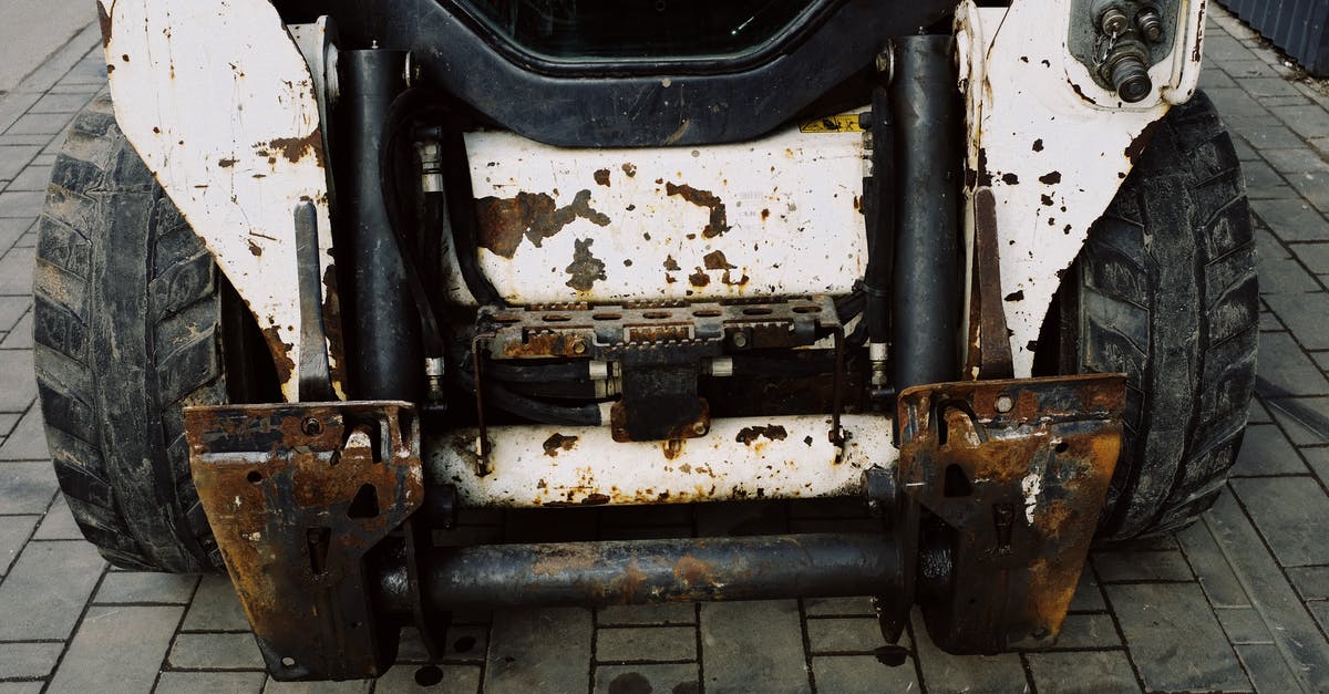 Tram service to Old Trafford from Manchester Picadilly? - From above place of arm installation on shabby heavy duty mini loader with white frame