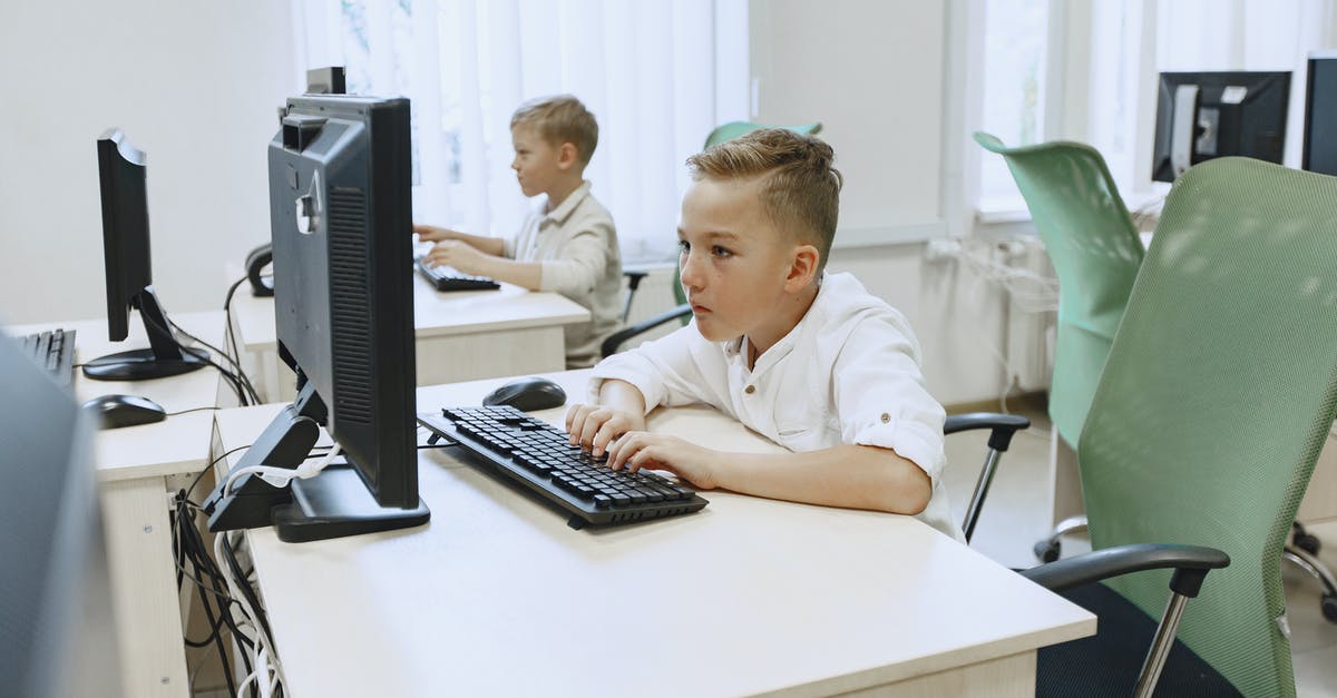 Transfer Desks at ARN (Stockholm-Arlanda)? - Boys Working on Computers in Classroom