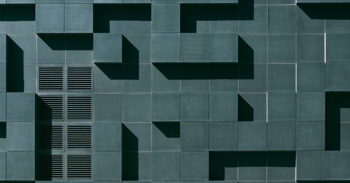 Transferring between airports in Oslo (Norway) [closed] - Gray Concrete Building Exterior With Geometric Design