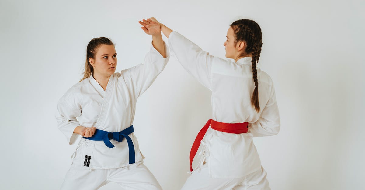 Transit rules when connecting in Tokyo on two different tickets - Two Girls Showing Karate Punch and Defense