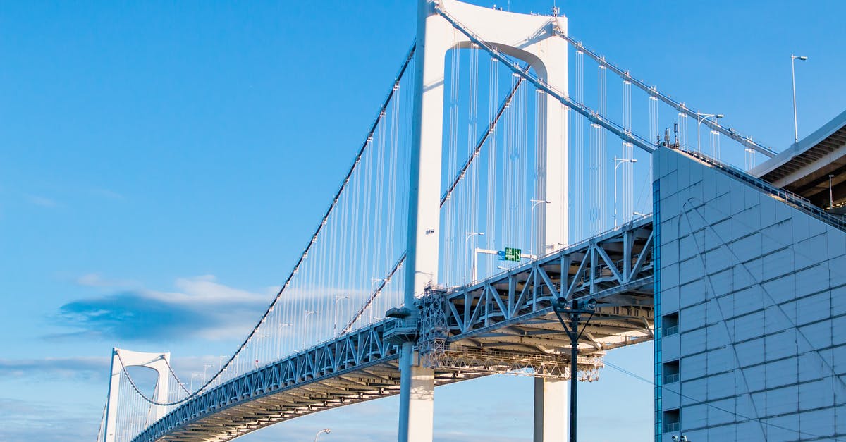 Transit rules when connecting in Tokyo on two different tickets - White Bridge Under Blue Sky