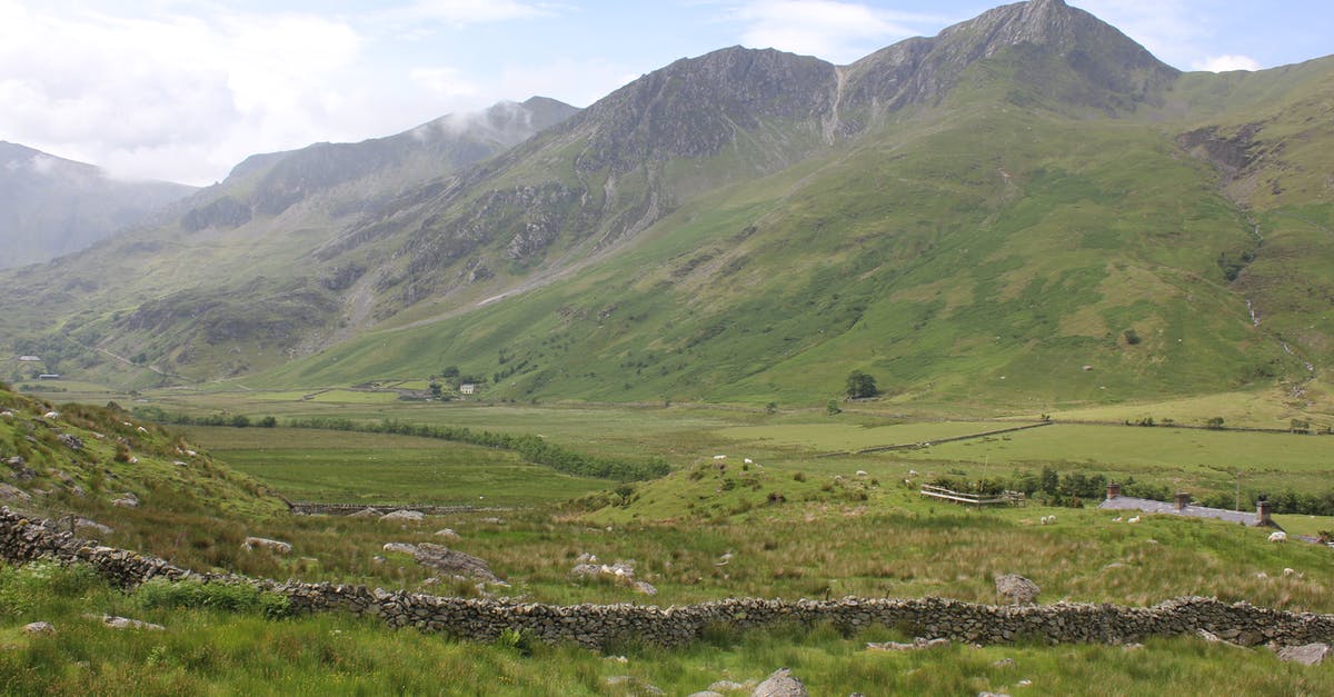 Transit via UK with a valid IM1 visa - Green Grass Field and Mountains